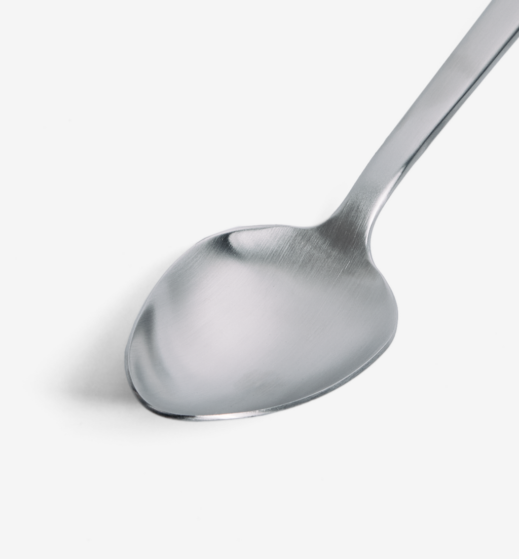 Stainless steel spoon with brushed matte finish and rounded bowl