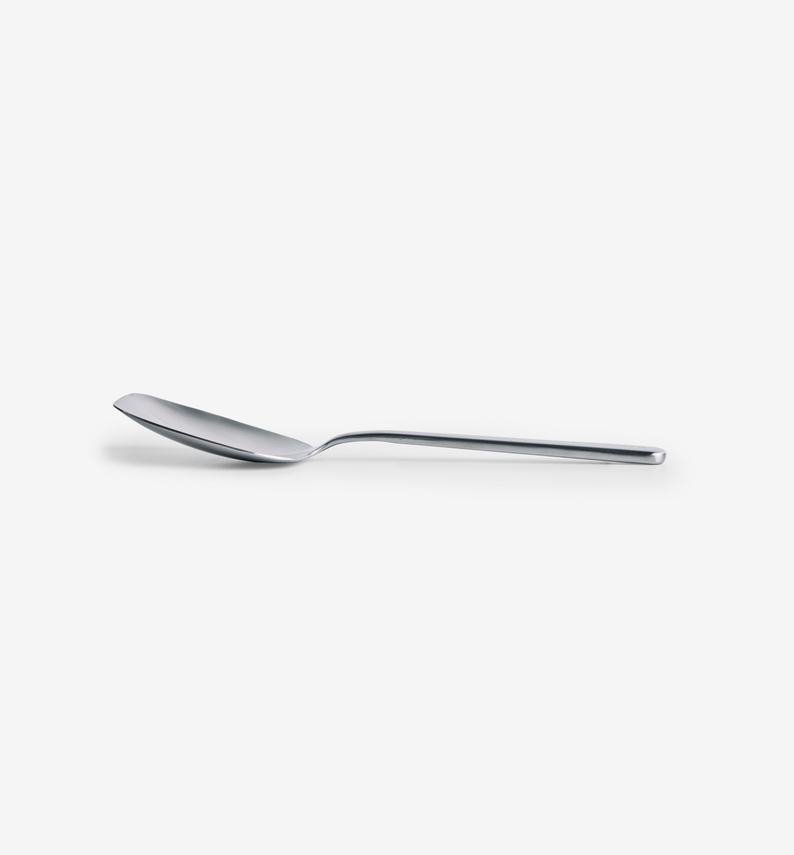 Stainless steel spoon with flat angular bowl and slim modern handle